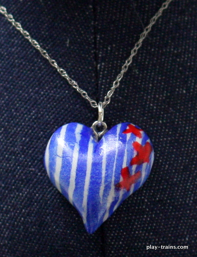 DIY Engineer Heart Pendants and Ornaments:  hickory (railroad) striped hearts for train lovers.  Use them as pendants or Christmas ornaments.  Easy to make with air dry clay and watercolors.  @ Play Trains!