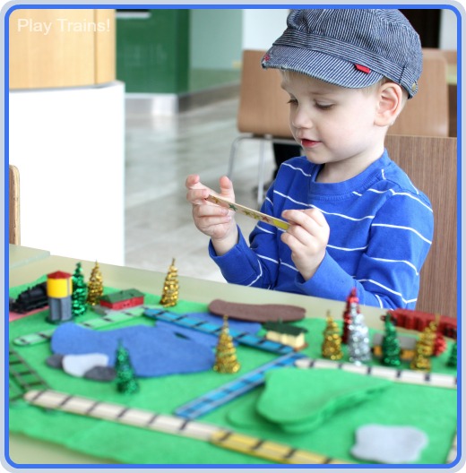 Portable Small World: Pretend Model Train Set @ Play Trains! Come see how big the Little Engineer grinned the first time he put together this DIY train set you can take along to play anywhere!