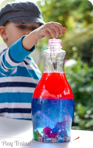 KID SAFE Two-Color Oil and Water Discovery Bottles @ Play Trains! http://play-trains.com/two-color-oil-and-water-discovery-bottles/ These vibrant discovery bottles contain no lamp oil, using all edible ingredients to make them safe for young children to make themselves!