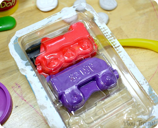 Recycled Play Dough Molds from Play Trains! A great way to reuse toy packaging after Christmas or birthday presents are unwrapped.