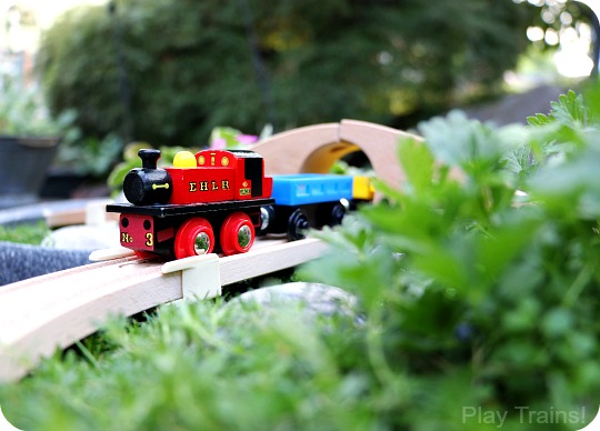 Super easy way to make a DIY outdoor wooden train "table"...no tools required to make this mini garden railway!