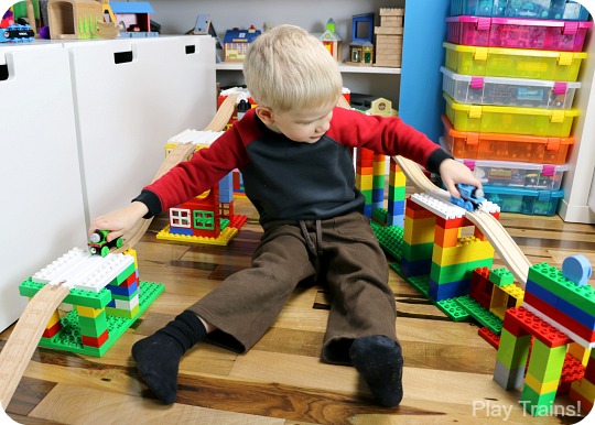 When Dreamup Toys sent us these building toys that connect wooden train tracks to interlocking building blocks to review, I knew they'd be cool, but I had no idea how they'd supercharge my son's creativity!