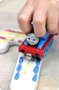 Painting with Trains: a Kid-made Thomas the Tank Engine Candy Cane Christmas Ornament