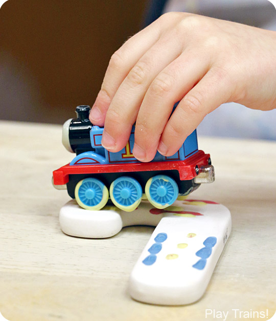 Painting with Trains: a Kid-made Thomas the Tank Engine Candy Cane Christmas Ornament -- including tips for painting with trains at a paint-your-own-pottery shop!