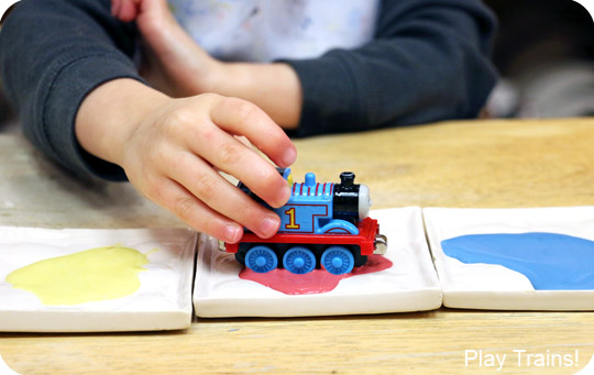 Painting with Trains: a Kid-made Thomas the Tank Engine Candy Cane Christmas Ornament -- including tips for painting with trains at a paint-your-own-pottery shop!