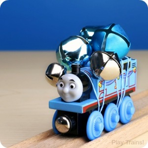 Jingle Trains: how to temporarily turn wooden trains into wooden train jingle bell shakers! Fun for ringing along with Christmas carols or for music activities all year long. http://play-trains.com/
