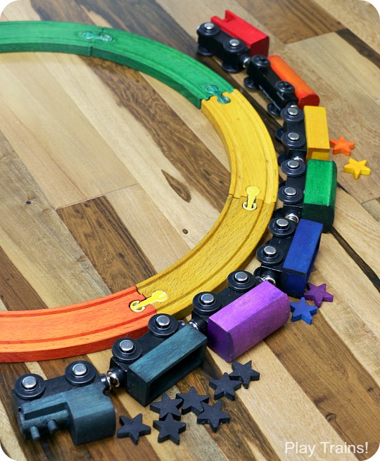 DIY Rainbow Wooden Train: beautiful, vibrant, non-toxic dye brightens up a wooden train set, inspired by the book 150+ Screen-Free Activities for Kids! Perfect for playing out the classic board book, Freight Train by Donald Crews.