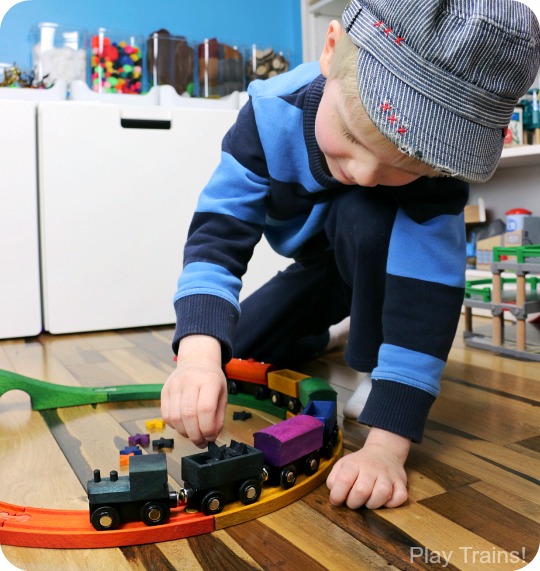 DIY Rainbow Wooden Train: beautiful, vibrant, non-toxic dye brightens up a wooden train set, inspired by the book 150+ Screen-Free Activities for Kids! Perfect for playing out the classic board book, Freight Train by Donald Crews.