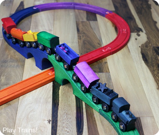 DIY Rainbow Wooden Train: beautiful, vibrant, non-toxic dye brightens up a wooden train set, inspired by the book 150+ Screen-Free Activities for Kids! Perfect for playing out the classic board book, Freight Train by Donald Crews.