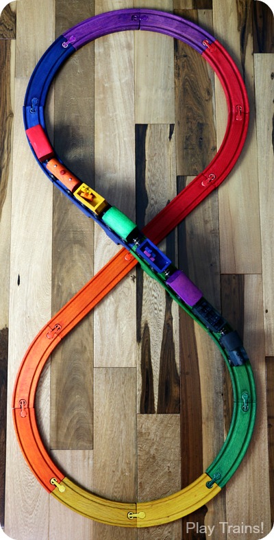 DIY Rainbow Wooden Train: beautiful, vibrant, non-toxic dye brightens up a wooden train set, inspired by the book 150+ Screen-Free Activities for Kids! Perfect for playing out the classic board book, Freight Train by Donald Crews.