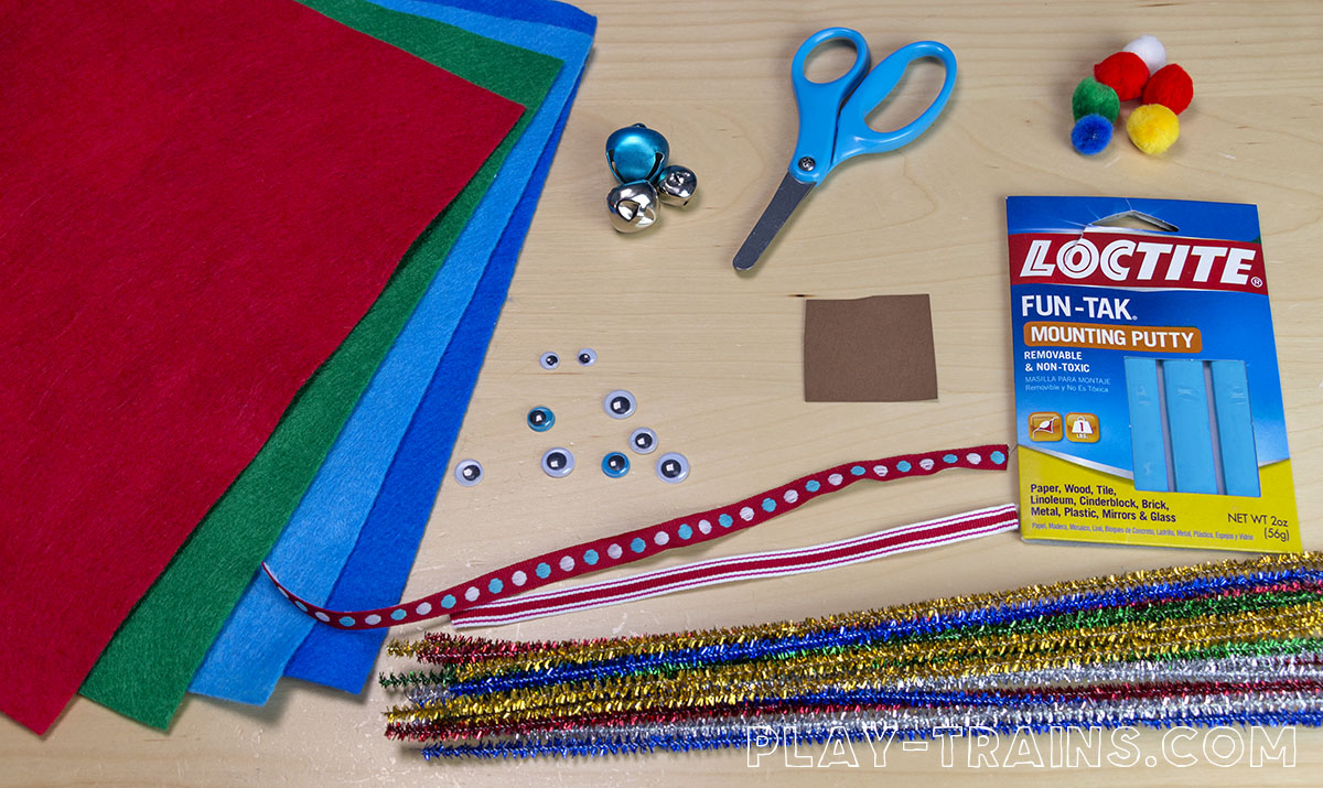 DIY wooden train track Christmas ornaments inspired by OLD TRACKS, NEW TRICKS by Jessica Petersen. The decorations are temporary so the tracks can go back to the train set after the holidays!